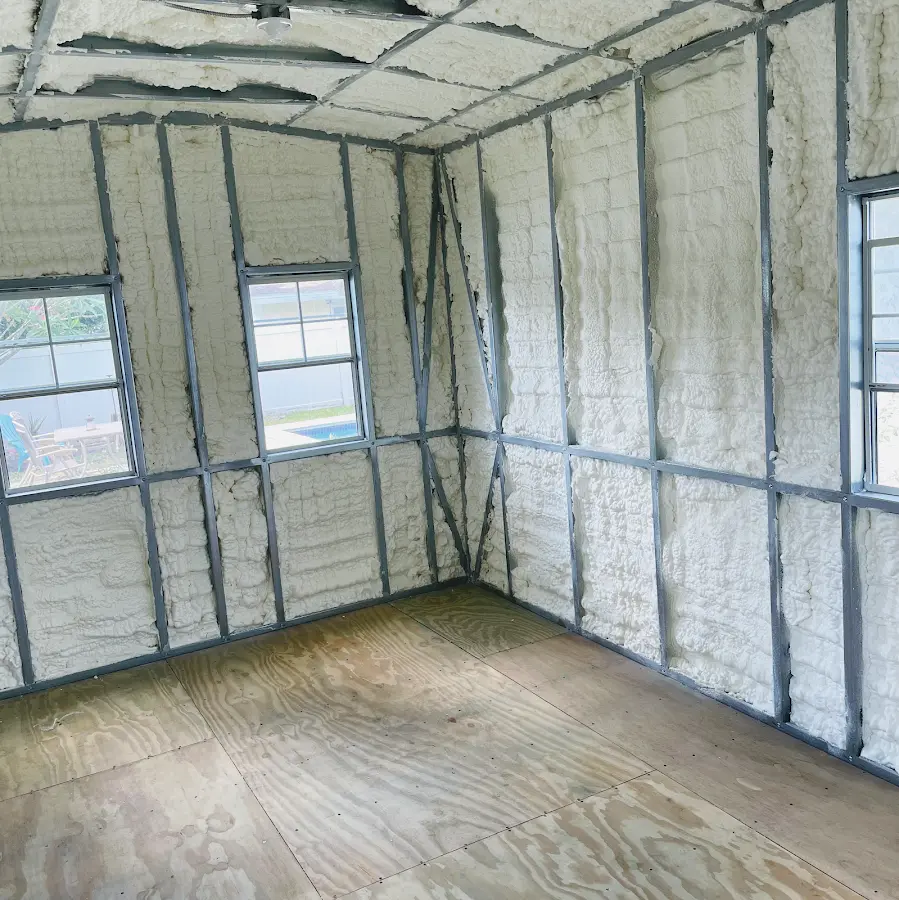 Closed-cell spray foam insulation applied to wall cavities in a residential project in Monticello