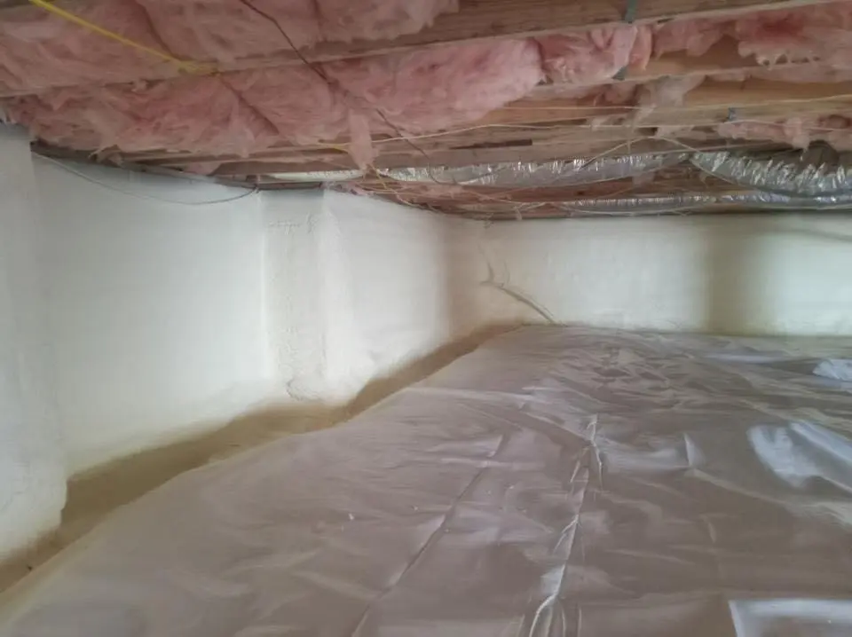 Crawl space encapsulation with closed-cell spray foam for Commercial Roof Restoration in Monticello
